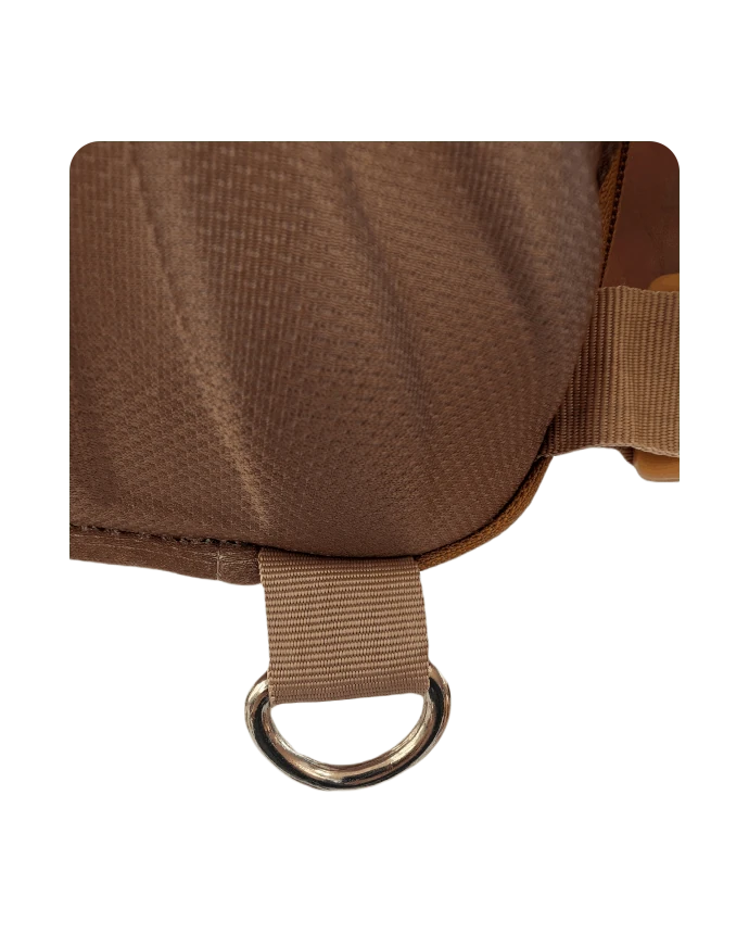 Maple, brown beaver-style backpack Close-up view of bottom hook